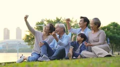 happy asian family taking a selfie