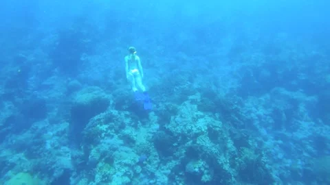 12982slow motion far away back view of a slim skinny Caucasian female woman snor Stock Footage 329060688