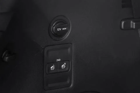 12V power outlet socket in the car. Closed socket in car. Stock-Fotos