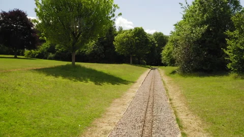 13. Aerial view with camera moving through a children trail rail in a park Stock Footage 132789536