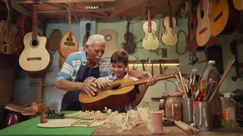13-Boy Learns Play Guitar With Senior Man Grandpa Stock Footage 62135523