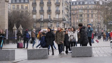 13 Rainy gray winter day Paris asian tourists walking in city Latin quarter Stock Footage 100814433