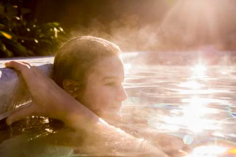 13 year old girl swimming in a pool Stock Photos