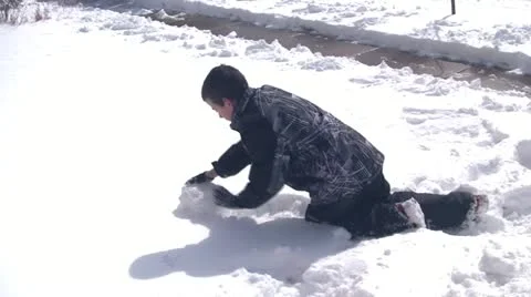 130212f boy making snowball Stock Footage 21441925