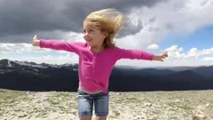 WINTER PARK COLORADO-2019: A Little Girl Smiling And Feeling The Effects On The