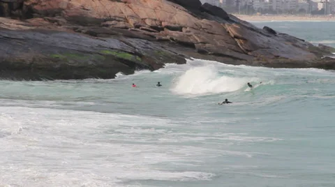 1306028 - Arpoador beach, Rio de Janeiro, young man getting surf Stock Footage 37816829