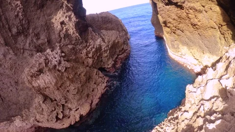 13151look out from Lover's cave down along the path way of ocean sea salt clear  Stock Footage 346590510