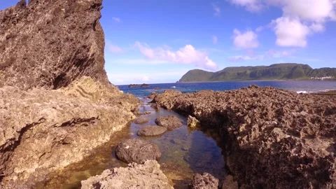 13152slow motion of looking up from the small little tidal pools with reef rock  Stock Footage 346589271