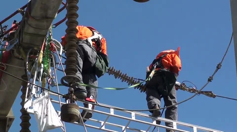 1316  Workers in high voltage pylons Stock Footage 36792392