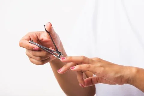 Close up young Asian woman have tool cutting nails fingernails on finger using a nail clipper. Female using tweezers by herself, studio shot isolated on white background, Healthcare concept xkwx nail, clipper, clip, cut, fingernail, human, hand, shorten, woman, trim, finger, tool, toenails, healthcare, adult, hands, fingers, people, girl, healthy, accessory, female, isolated, cutout, clean, instrument, clippers, health, young, thai, asian, care, beauty, manicure, closeup, hygiene, scissors, person, stainless, steel, body, cosmetics, skin, object, trimmer, metal, trimming, beautiful, equipment, white