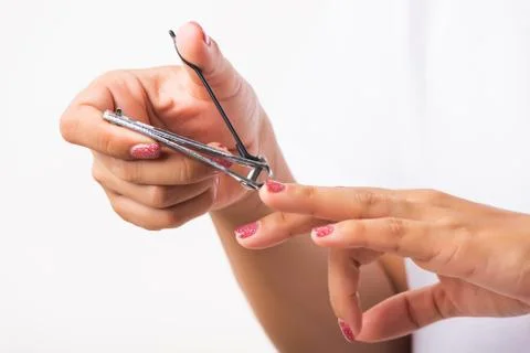Close up young Asian woman have tool cutting nails fingernails on finger using a nail clipper. Female using tweezers by herself, studio shot isolated on white background, Healthcare concept xkwx nail, clipper, clip, cut, fingernail, human, hand, shorten, woman, trim, finger, tool, toenails, healthcare, adult, hands, fingers, people, girl, healthy, accessory, female, isolated, cutout, clean, instrument, clippers, health, young, thai, asian, care, beauty, manicure, closeup, hygiene, scissors, person, stainless, steel, body, cosmetics, skin, object, trimmer, metal, trimming, beautiful, equipment, white