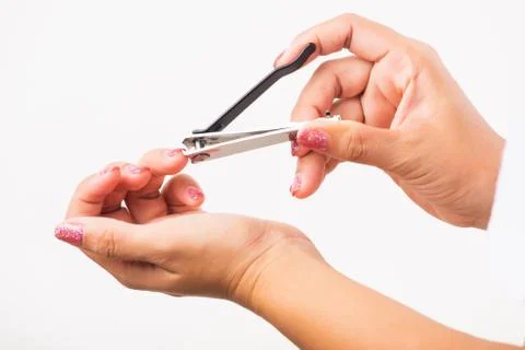 Close up young Asian woman have tool cutting nails fingernails on finger using a nail clipper. Female using tweezers by herself, studio shot isolated on white background, Healthcare concept xkwx nail, clipper, clip, cut, fingernail, human, hand, shorten, woman, trim, finger, tool, toenails, healthcare, adult, hands, fingers, people, girl, healthy, accessory, female, isolated, cutout, clean, instrument, clippers, health, young, thai, asian, care, beauty, manicure, closeup, hygiene, scissors, person, stainless, steel, body, cosmetics, skin, object, trimmer, metal, trimming, beautiful, equipment, white