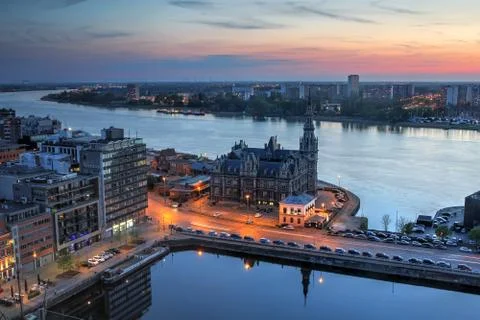 Aerial  view  over  the  city  of  Antwerp  in  Belgium  from  the  MAS  tower  at  twilight  time. xkwx antwerp,  belgium,  belgian,  skyline,  aerial,  twilight,  dusk,  houses,  blue  hour,  old  town,  cathedral,  landmarks,  architecture,  above,  bird  eye,  panoramic,  europe,  european,  red  light  district,  mas  tower,  view,  vista,  vantage  point,  sky,  streets,  restaurants,  benelux,  schelde,  river,  scheldt  river,  antwerpen,  HDR