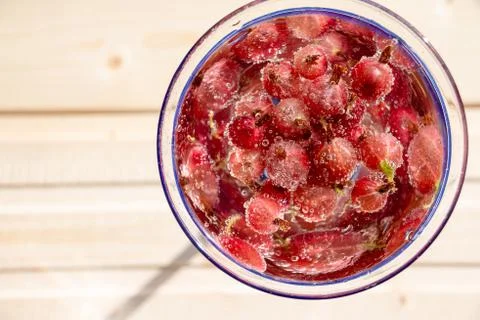 Glass  of  cold  refreshing  summer  drink  with  berries  and  ice  cubes  on  table  close  up xkwx gooseberry,  fruit,  healthy,  fresh,  food,  refreshing,  refreshment,  sweet,  juice,  soft  drink,  tasty,  party,  berries,  drink,  nonalcoholic,  glass,  green,  cold,  cool,  cocktail,  beverage,  nature,  closeup,  liquid,  lemonade,  juicy,  wooden,  ice,  table,  water,  taste,  soft,  tea,  space,  syrup,  text,  agriculture,  bio,  copy,  cubes,  energy,  herb,  red,  medical,  iced,  sunlight,  sun,  ripe,  freshness