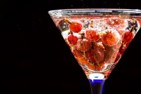 Glass  of  cold  refreshing  summer  drink  with  berries  and  ice  cubes  on  table  close  up xkwx gooseberry,  fruit,  healthy,  fresh,  food,  refreshing,  refreshment,  sweet,  juice,  soft  drink,  tasty,  party,  berries,  drink,  nonalcoholic,  glass,  green,  cold,  cool,  cocktail,  beverage,  nature,  closeup,  liquid,  lemonade,  juicy,  wooden,  ice,  table,  water,  taste,  soft,  tea,  space,  syrup,  text,  agriculture,  bio,  copy,  cubes,  energy,  herb,  red,  medical,  iced,  sunlight,  sun,  ripe,  freshness