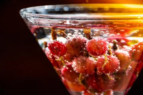 Glass  of  cold  refreshing  summer  drink  with  berries  and  ice  cubes  on  table  close  up xkwx gooseberry,  fruit,  healthy,  fresh,  food,  refreshing,  refreshment,  sweet,  juice,  soft  drink,  tasty,  party,  berries,  drink,  nonalcoholic,  glass,  green,  cold,  cool,  cocktail,  beverage,  nature,  closeup,  liquid,  lemonade,  juicy,  wooden,  ice,  table,  water,  taste,  soft,  tea,  space,  syrup,  text,  agriculture,  bio,  copy,  cubes,  energy,  herb,  red,  medical,  iced,  sunlight,  sun,  ripe,  freshness