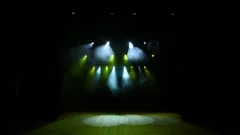 Free stage with green lights, lighting devices, smoke fog.