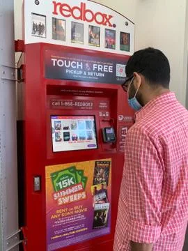 Mckinney, TX / USA - : A man wear a mask stand in front of the redbox ...