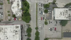 Aerial top down shot of city traffic at an intersection in downtown