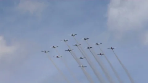 14 plane formation - fly by. Planes split off at end Stock Footage 90367020