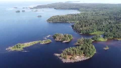 14-second vertical drone ascent over lush green islands under a clear summer sky Stock Footage 311949892