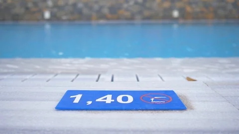 "1,40 M." Depth marking on pool edge.inscription of the swimming pool depth.pool Stock Footage 97962506
