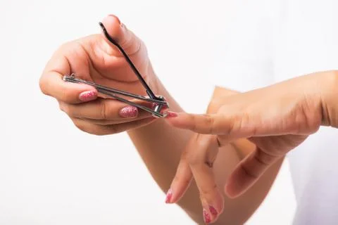 Close up young Asian woman have tool cutting nails fingernails on finger using a nail clipper. Female using tweezers by herself, studio shot isolated on white background, Healthcare concept xkwx nail, clipper, clip, cut, fingernail, human, hand, shorten, woman, trim, finger, tool, toenails, healthcare, adult, hands, fingers, people, girl, healthy, accessory, female, isolated, cutout, clean, instrument, clippers, health, young, thai, asian, care, beauty, manicure, closeup, hygiene, scissors, person, stainless, steel, body, cosmetics, skin, object, trimmer, metal, trimming, beautiful, equipment, white