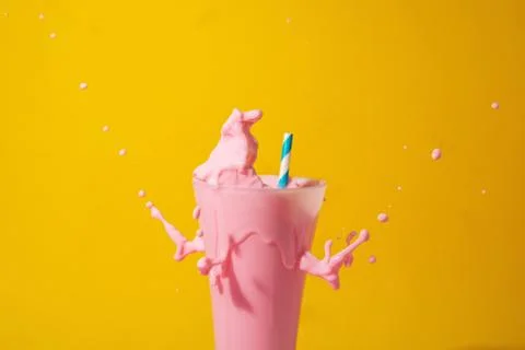 A  glass  of  strawberry  smoothie  isolated  on  yellow  and  pink  background xkwx fruit,  diet,  berry,  strawberry,  drink,  healthy,  nutrition,  food,  fresh,  blended,  vitamin,  milkshake,  background,  summer,  smoothie,  sweet,  dessert,  refreshment,  juicy,  juice,  glass,  pink,  isolated,  straw,  beverage,  horizontal,  yellow