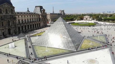 14.06.2018, France - Louvre Pyramid from glass near museum in edifice of Royal Stock Footage