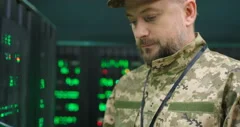 Close up of Caucasian senior military man in uniform typing on keyboard of