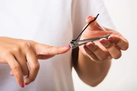 Close up young Asian woman have tool cutting nails fingernails on finger using a nail clipper. Female using tweezers by herself, studio shot isolated on white background, Healthcare concept xkwx nail, clipper, clip, cut, fingernail, human, hand, shorten, woman, trim, finger, tool, toenails, healthcare, adult, hands, fingers, people, girl, healthy, accessory, female, isolated, cutout, clean, instrument, clippers, health, young, thai, asian, care, beauty, manicure, closeup, hygiene, scissors, person, stainless, steel, body, cosmetics, skin, object, trimmer, metal, trimming, beautiful, equipment, white
