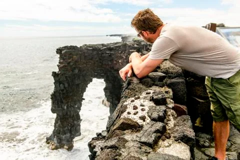 Man at the Holei Sea Arch, Hawaii Volcanoes National Park xkwx {Holei,Sea,Archhole,waterscape,man,arch,cliff,coast,hawaii,island,landscape,lava,nature,ocean,pacific,park,usa,volcano,wave,america,froth,geology,hilo,kilauea,shore,shoreline,big,volcanoes,national,flow,national park,polynesia,united,states,craters,rock,chain,natural,tropical,white,bigisland,cave,colorful,edge}