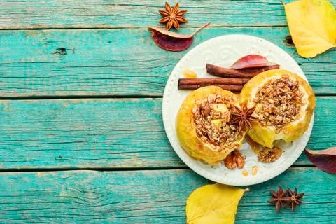 Baked apples stuffed with granola and nuts.Baked apples with nuts.Space for text xkwx apple baked stuffed fruit dessert stuffed apple sweetness stuffed apples nut dessert autumn oatmeal filled food fruit baked apple sweet cinnamon plate delicious fall homemade sugar walnut tasty bake caramel season dish syrup sauce eat prepared cinnamon stick scoop fallen leaves seasonal tempting granola appetizing copy space space for text wooden background wooden table