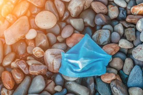Video: Close-up used Face mask on pebble beach, have started polluting ...