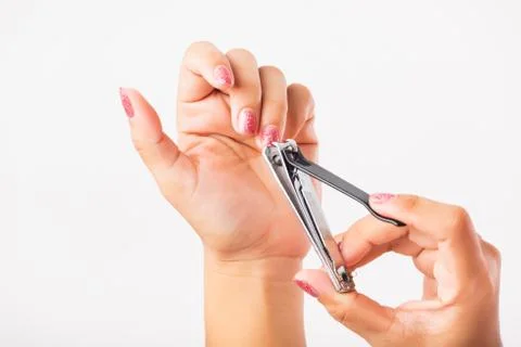Close up young Asian woman have tool cutting nails fingernails on finger using a nail clipper. Female using tweezers by herself, studio shot isolated on white background, Healthcare concept xkwx nail, clipper, clip, cut, fingernail, human, hand, shorten, woman, trim, finger, tool, toenails, healthcare, adult, hands, fingers, people, girl, healthy, accessory, female, isolated, cutout, clean, instrument, clippers, health, young, thai, asian, care, beauty, manicure, closeup, hygiene, scissors, person, stainless, steel, body, cosmetics, skin, object, trimmer, metal, trimming, beautiful, equipment, white