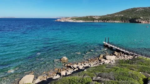 144-Sideways Drone Shot Along Sardinian Coast with Turquoise Waters and Wood 库存影片 334062987