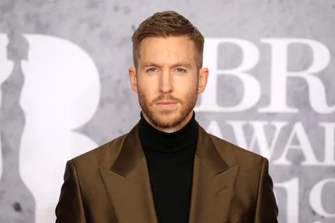 LONDON, UNITED KINGDOM - Feb 20, 2019: Calvin Harris attends attends The BRIT Awards 2019 at The O2 Arena on February 20, 2019 in London, UK. xkwx scottish, dj, singer, portrait, eye contact, posing, male, personality, alone, head shot, awards, red carpet