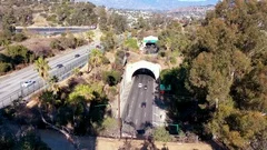 Aerial freeway cars travel along the 110 freeway in Los Angeles through tunnels