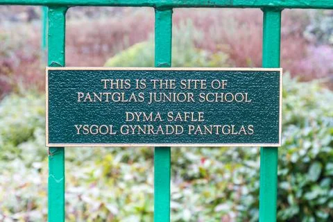 Aberfan, Wales This is the site of Pantglas Junior School sign on gate to Disaster Memorial Garden, on February 17 2019 in UK, portrait. xkwx Editorial, Aberfan, Disaster, Memorial Garden, gate, entrance, sign, path, Pantglas, Junior, School, NCB, Coal, Slurry, remembrance, Merthyr Tydfil, quiet, reflection, peace, monument, symbol, memory, death, welsh, children, teacher, scandal, portrait, victim
