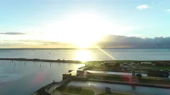 Aerial over watergate in Harbor of Wilhemshaven at sunset