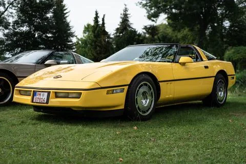 DIEDERSDORF,  GERMANY  -  AUGUST  30,  2020:  The  sports  car  Chevrolet  Corvette  (C4)  Targa  Top,  1985.  The  exhibition  of  "US  Car  Classics". xkwx machine,  chrome,  ancient,  antique,  auto,  automobile,  car,  design,  germany,  history,  nostalgia,  old,  oldtimer,  retro,  transport,  vehicle,  vintage,  Diedersdorf,  US,  USA,  America,  classics,  2-door,  sports  car,  Chevrolet,  Corvette,  C4,  Targa  Top