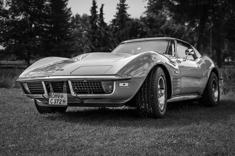 DIEDERSDORF,  GERMANY  -  AUGUST  30,  2020:  The  sports  car  Chevrolet  Corvette  Stingray  Coupe,  1972.  Black  and  white.  The  exhibition  of  "US  Car  Classics". xkwx machine,  chrome,  ancient,  antique,  auto,  automobile,  car,  design,  germany,  history,  nostalgia,  old,  oldtimer,  retro,  transport,  vehicle,  vintage,  Diedersdorf,  US,  USA,  America,  classics,  2-door,  sports  car,  Chevrolet,  Corvette,  Stingray,  Coupe,  black,  white