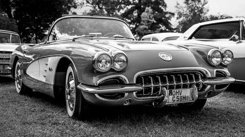 DIEDERSDORF,  GERMANY  -  AUGUST  30,  2020:  The  sports  car  Chevrolet  Corvette  (C1),  1958.  Black  and  white.  The  exhibition  of  "US  Car  Classics". xkwx chrome,  diedersdorf,  2-door,  america,  american,  ancient,  antique,  auto,  automobile,  automotive,  black,  c1,  cabrio,  cabriolet,  car,  chevrolet,  classic,  convertible,  corvette,  design,  front,  germany,  iconic,  model,  nostalgia,  old,  oldtimer,  retro,  shine,  sports  car,  style,  transport,  us,  usa,  vehicle,  vette,  vintage,  white
