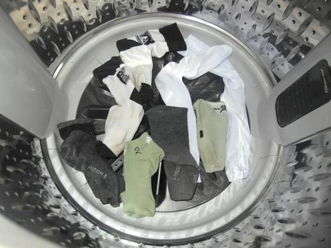 ถุงเท้าในเครื่องซักผ้า Stock Photos