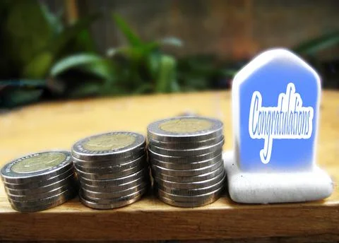 เหรียญและข้อความยินดีด้วย 写真素材