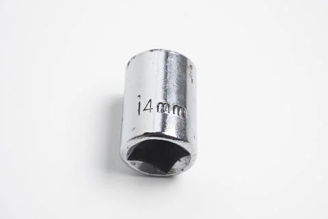 A 14mm socket made of chrome-plated steel, showing signs of wear and rust. .. Stock Photos