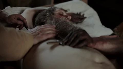 14th century bubonic plague sufferer being treated by barber surgeon #1 Stock Footage 145970227
