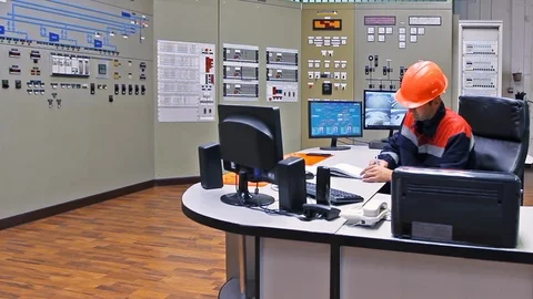 15 0483 EngineerSitsAndWrites Stock Footage 105459389