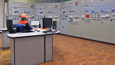 15 0489 ch2 EngineerSitsAndWatchingCircuits Stock Footage 105460505