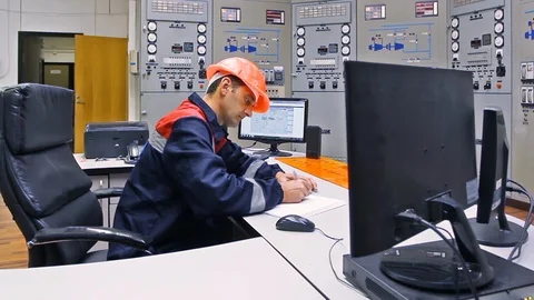 15 0492 ch2 EngineerWritesLooksMonitor Stock Footage 105464432